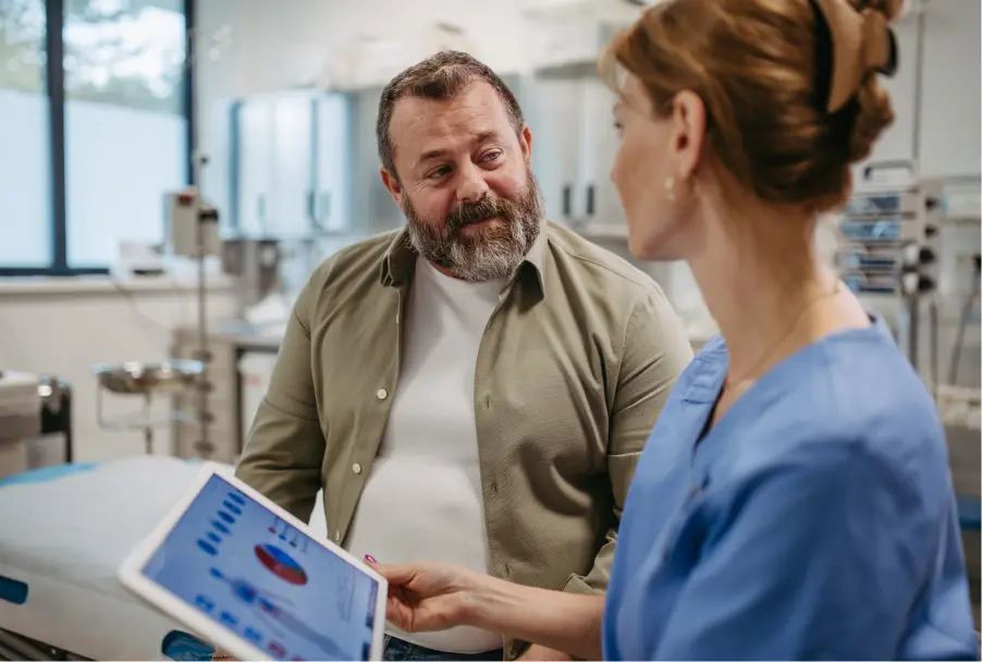 Older man speaking with a medical practicioner