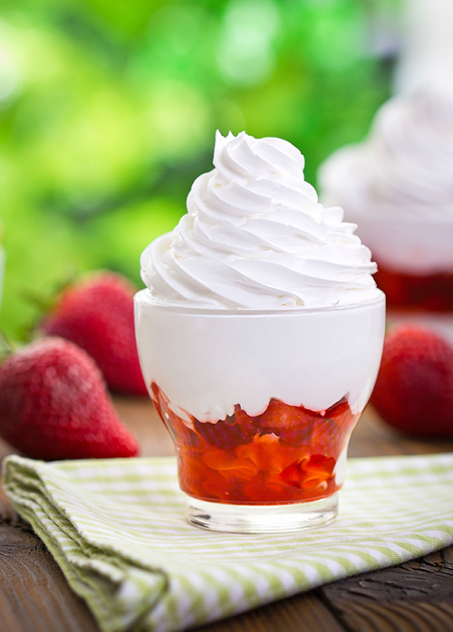 Vanilla frozen yogurt with strawberries to help fight your junk food cravings
