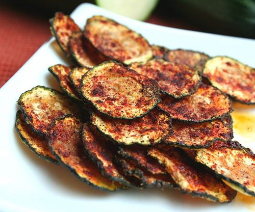 Healthy snack alternatives like zucchini chips with smoked paprika
