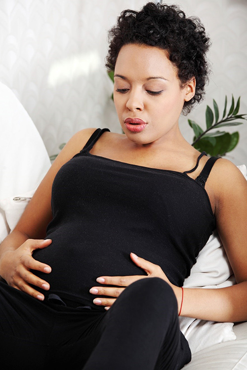 Young woman practicing conception breathing techniques after bariatric surgery