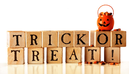 trick or treat Halloween sign with a jack-o-lantern and candy corn