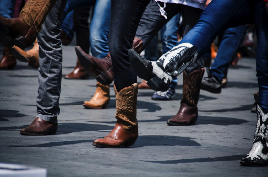 People in cowboy boots dancing