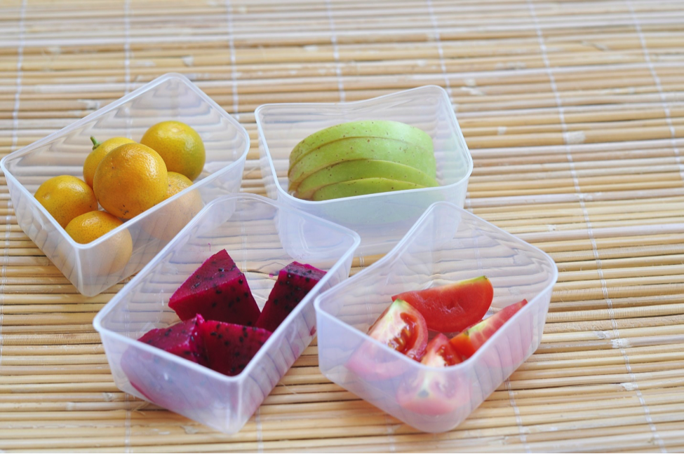 Tupperware of healthy snacks for parents on the go watching their back-to-school health.
