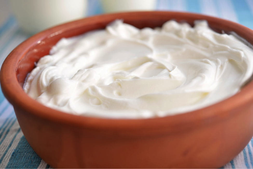 Bowl of Greek yogurt as example of high protein snack.
