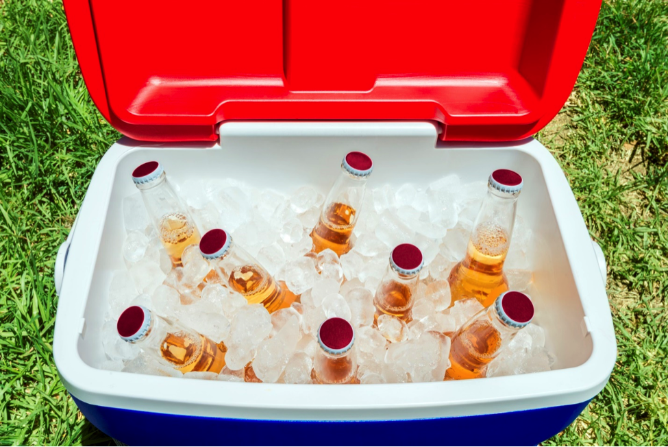Cooler of beer as an example of what to avoid for a healthy tailgating experience.