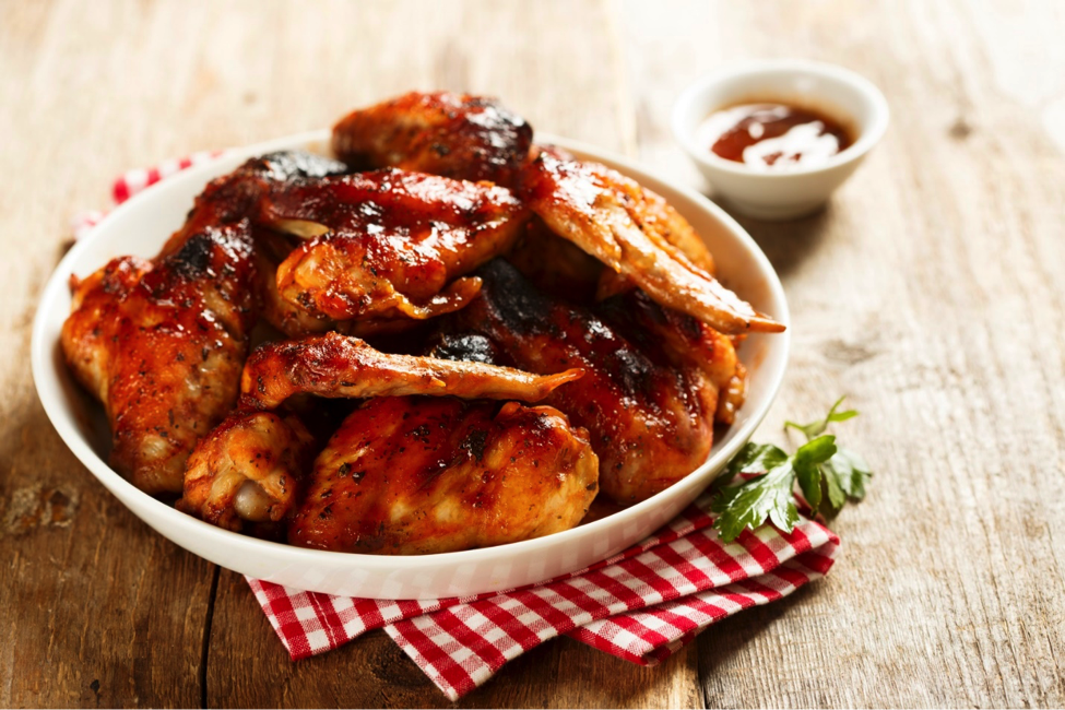 Non-Breaded Buffalo Wings with sauce for healthy tailgating.