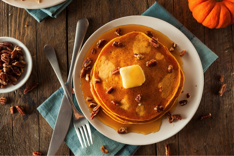 Healthy pumpkin pecan pancakes on plate
