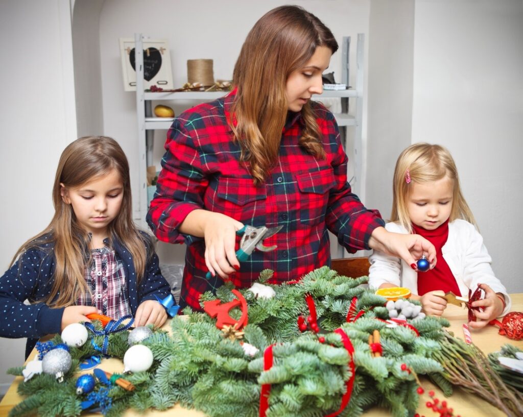 Mom having children help her with projects to ease holiday stress