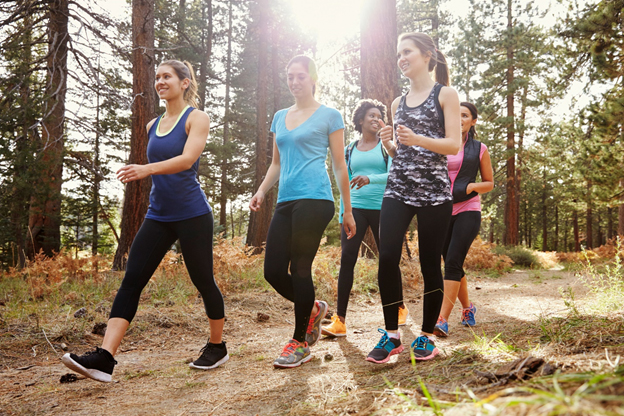 Group of young woman walking through nature