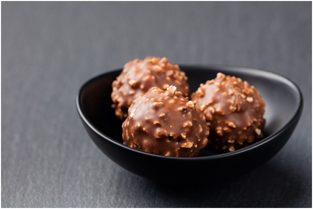 Chocolate balls with nuts in a bowl