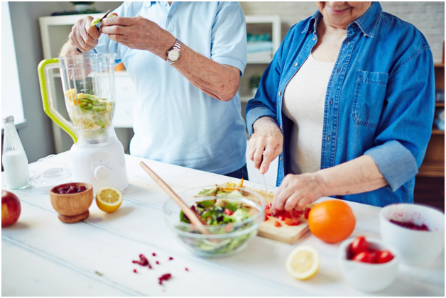 Couple preparing healthy meals and snacks