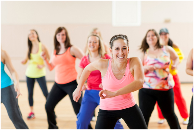 Group of women trying a dance fitness class to achieve new year’s health bucket list