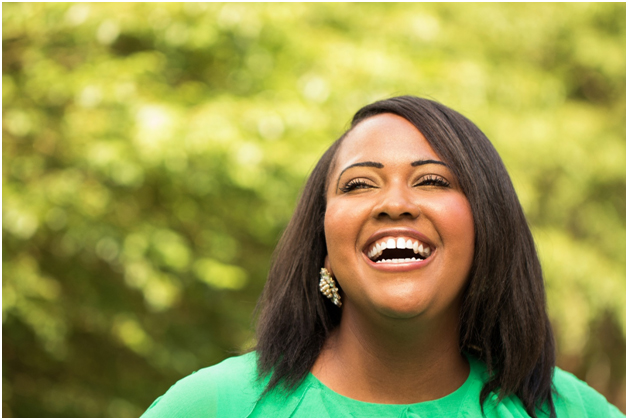 Woman laughing and feeling confident about her new year’s health