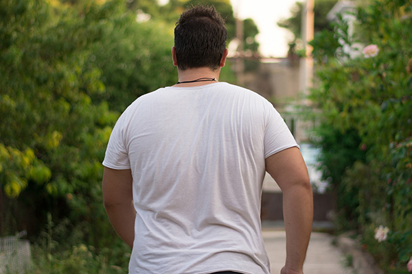 Man taking a walk outside as a healthy Lent resolution.