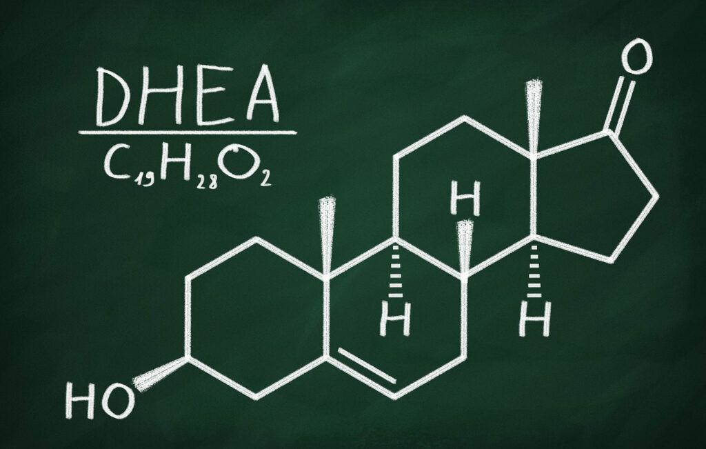 The word ‘DHEA” written above chemical formula and elemental structure.
