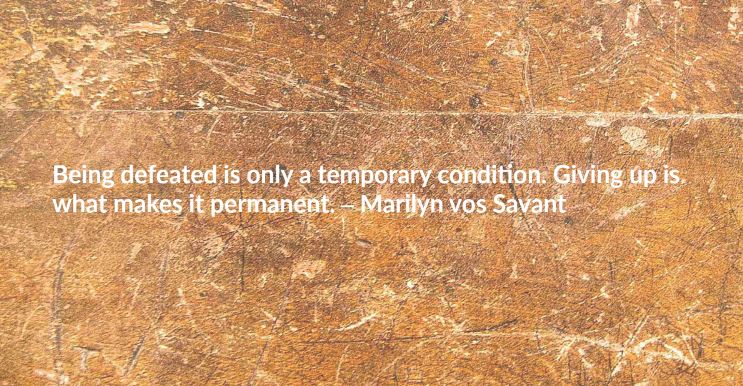 Weight loss motivational quote reading “Being defeated is only a temporary condition. Giving up is what makes it permanent. – Marilyn vos Savant”